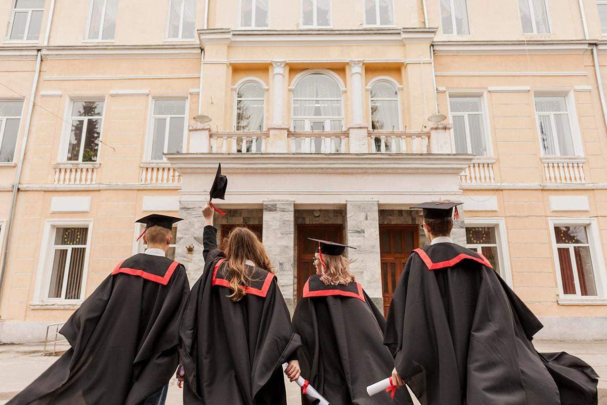 Students looking at university building